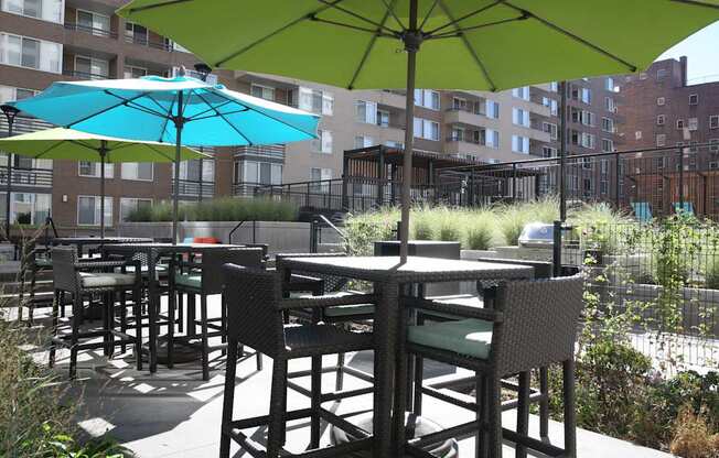 an outdoor patio with tables and umbrellas