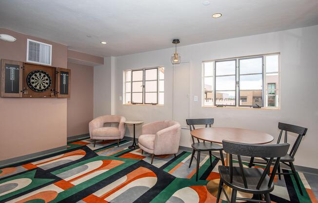 a living room filled with furniture and a large window