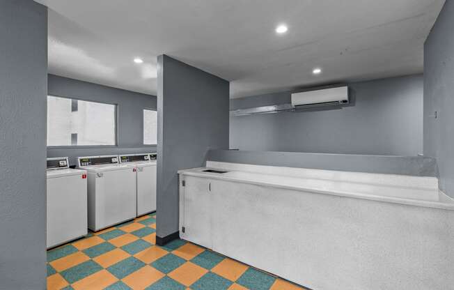 a laundry room with a washer and dryer