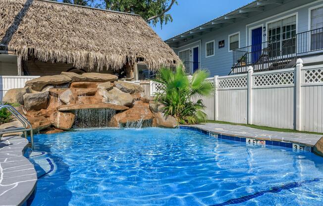 a large pool of water in front of a house