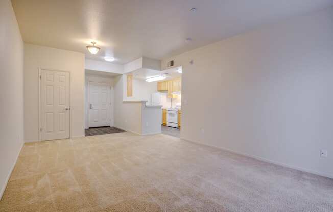 an empty living room with a kitchen in the background  at Seville at Gale Ranch, San Ramon