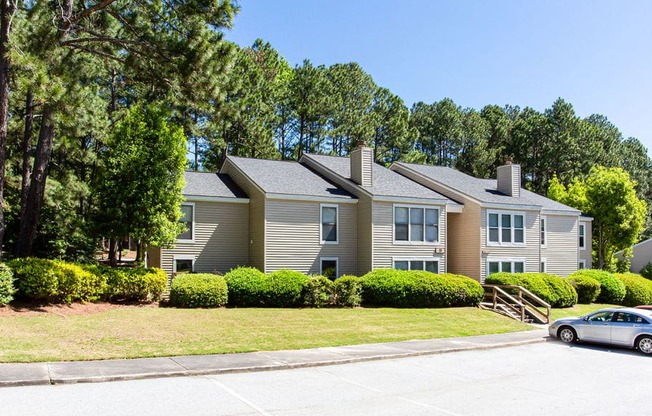 a house with a car parked in front of itat Hidden Lake, Union City, GA, 30291