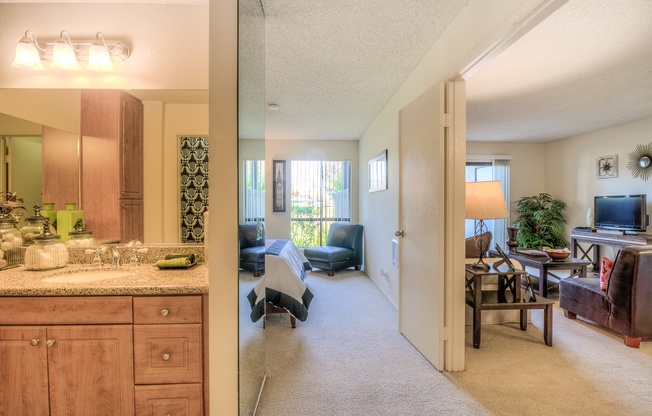 A living room with a couch and a television.