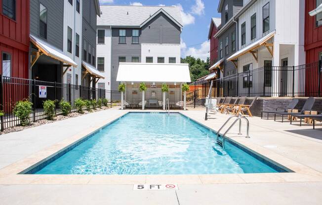 exterior pool and townhomes on sunny day