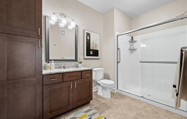 a bathroom with a toilet and a shower