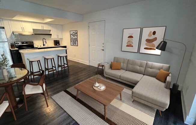 A modern living room with a grey couch and a wooden coffee table.