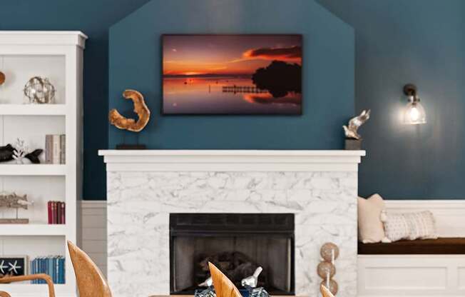 A living room with a fireplace and a painting above it.