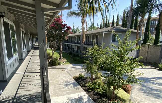 a view of the sidewalk in front of a building