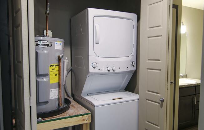 Stacked washer and dryer off bathroom at Northridge Heights in Lincoln