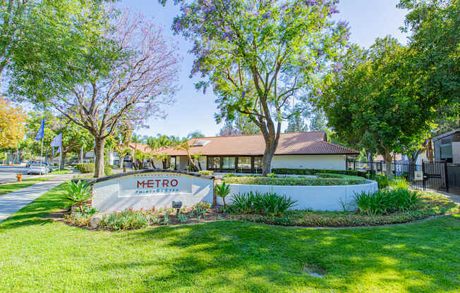 A sign that says Metro in front of a building.