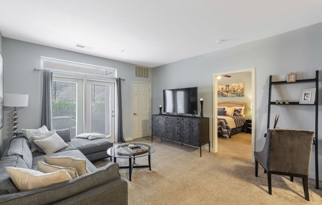 a living room with a couch and a tv