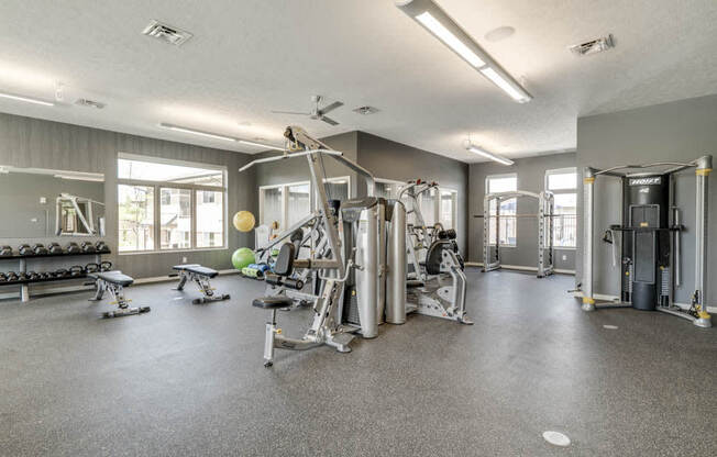 Fitness center with free weights and weightlifting machines at The Villas at Falling Waters townhomes in West Omaha NE