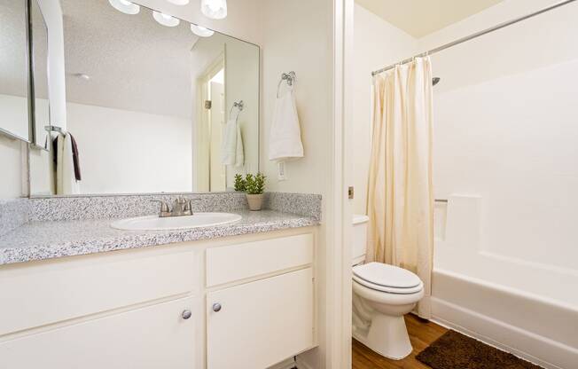 Bathroom with sink, toilet and shower at Woodbend, California, 91701