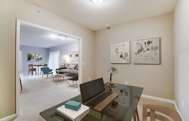 a home office with a laptop computer on a desk