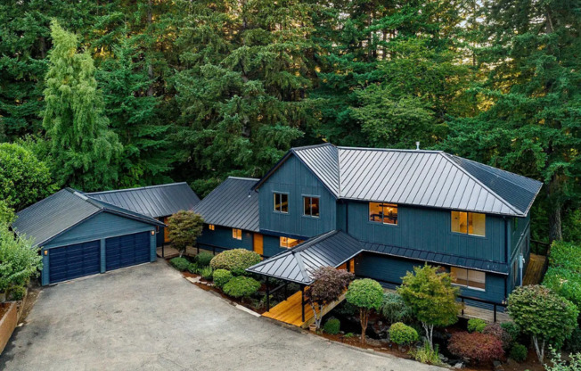 Welcome to your Private Luxury Sanctuary that Sits on 1.66 Serene Acres Complete with ADU and Private Walking Trails!