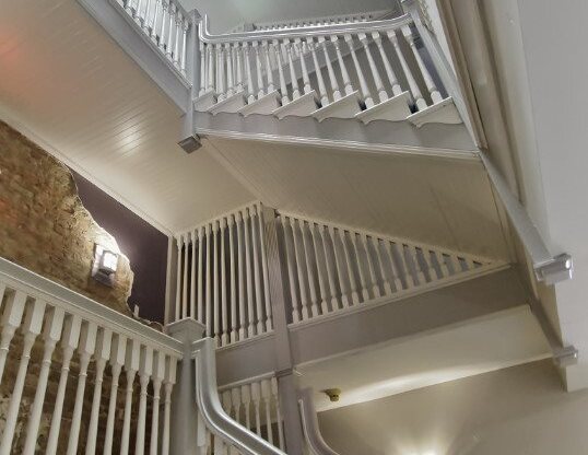 Original Staircase in the Common Area at Tremont Terraces Apartments in Cleveland, Integrity Realty LLC