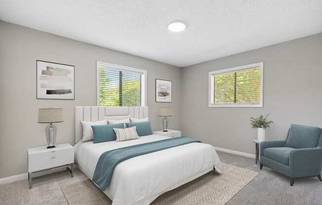 a bedroom with a bed and a chair in a 555 waverly unit