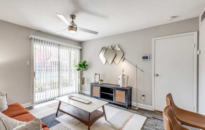 the living room of an apartment with a couch and a coffee table