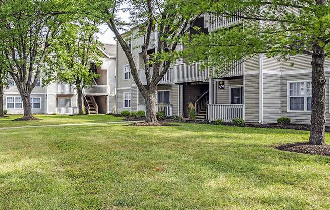 our apartments have green grass and shade trees