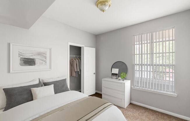 a bedroom with a bed and a closet at Veranda at Centerfield, Texas, 77070