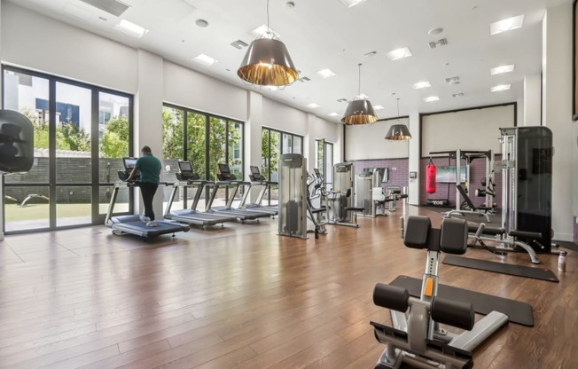 the gym at the district at highland village apartments