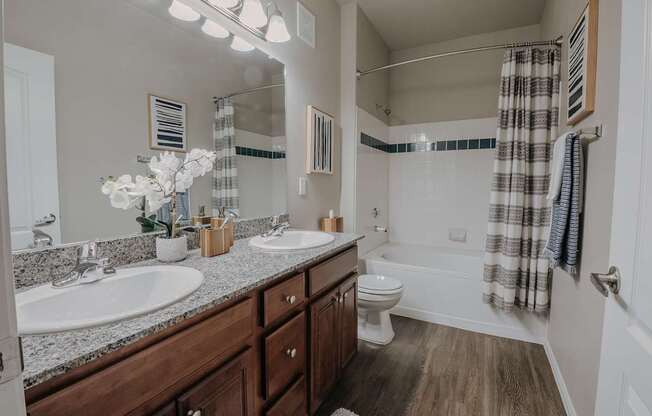 A bathroom with a white sink, a white toilet, and a white bathtub.