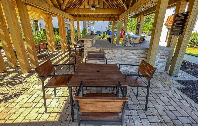 Outdoor dining area at Two Addison Place Apartments , Pooler, 31322