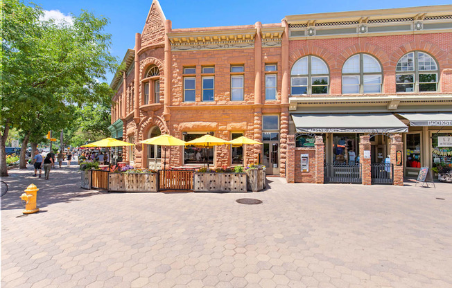 A street view of a building with a bakery on the ground floor.