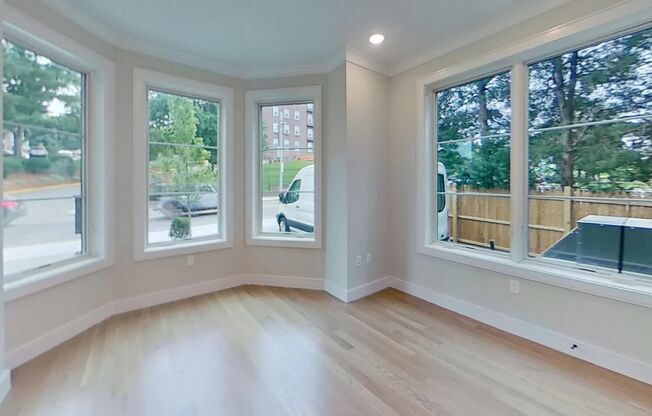 Steps from The T Stop. High-End Amenities. Central AC, In Unit Washer/Dryer