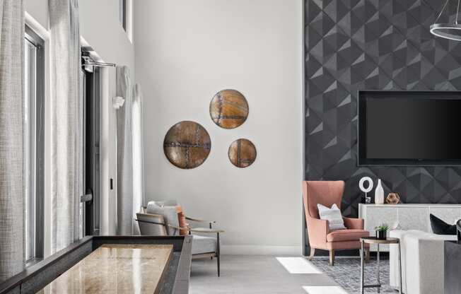 a living room with white walls and a large window and a wooden table at The Sophia, Venice, FL, 34275