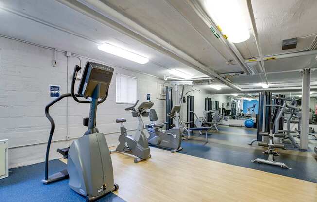 Fitness center with cardio and strength training equipment at Mason Hall in Alexandria, VA 22314