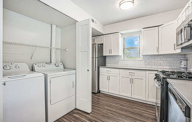 a kitchen with washer and dryer at The Crossings Apartments, Michigan, 49508