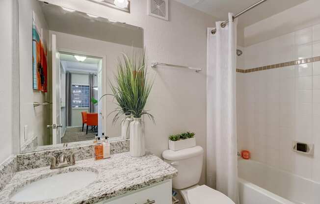 the preserve at ballantyne commons apartment bathroom with sink toilet and shower