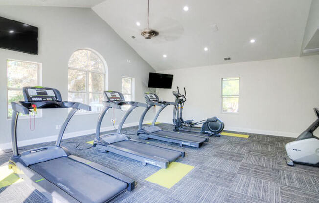 fitness center with cardio machines
