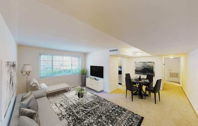 living area with sofa, coffee table, large windows, and views of kitchen and dining areas at cambridge square apartments in bethesda md