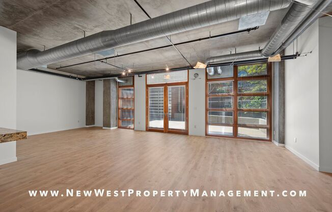 Expansive East Village loft at Parkloft, available now! 1 parking space included! Small pet OK!