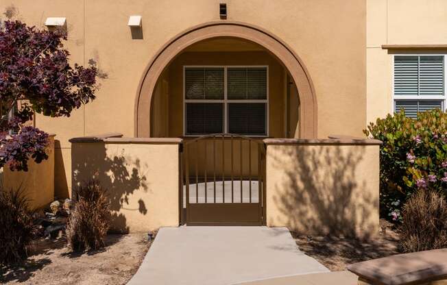 the front door of a house with a wheelchair ramp in front of it