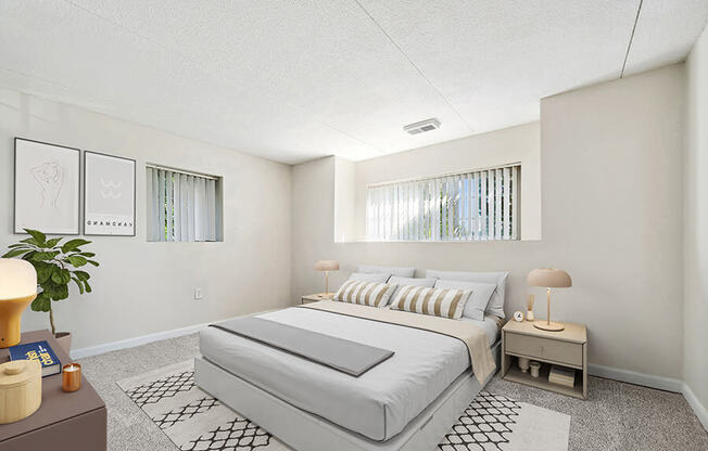 Model Bedroom with Carpet and Window View at Heights Marlborough Apartments in Boston, MA.