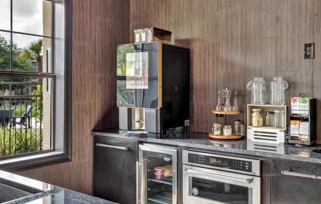 a kitchen with a stove top oven next to a window