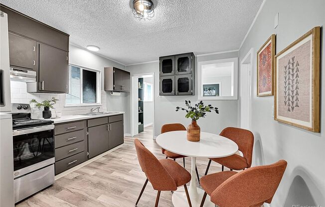 LOCATION LOCATION!!  LOHI Italian styled single family home.  Remodeled with LVT flooring, Granite counter tops & fenced-in-yard!