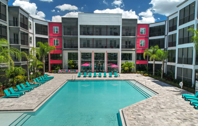 a swimming pool in front of an apartment building at Pinnacle Apartments, Jacksonville, 32256