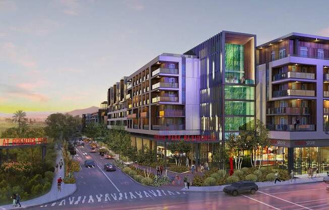 A modern building complex with a street in front of it.