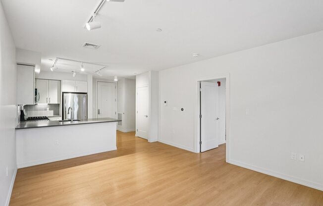 Spacious living room with kitchen view at Park77 Apartments, Cambridge, 02138