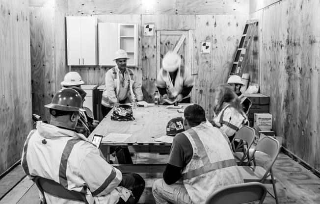 During Renovation: Construction team meeting during the now-completed renovation project of the building