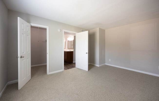 A room with carpeted floors and white walls.