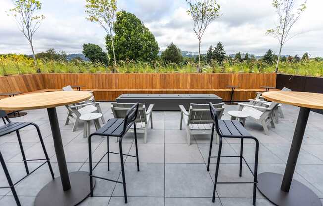 a patio with tables and chairs and a pool