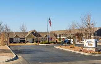 Cresscent Ridge is a residential complex with a flag flying in front.