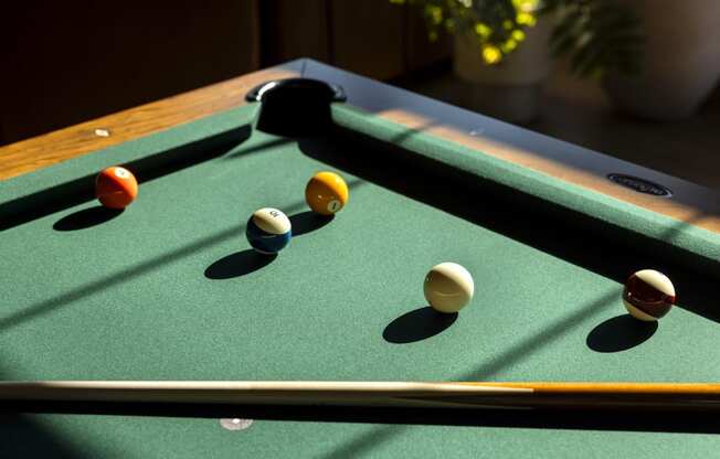 a pool table with billiard balls on it