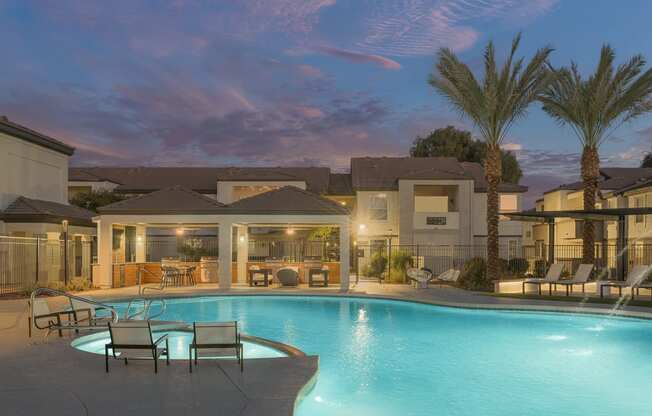 a swimming pool at night at the resort at governors crossing