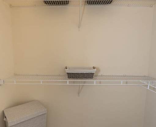 Primary bedroom walk-in closet.